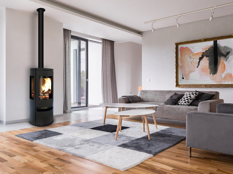 Modern living room with fireplace sofa balcony and pattern carpet